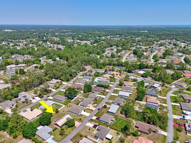birds eye view of property with a residential view