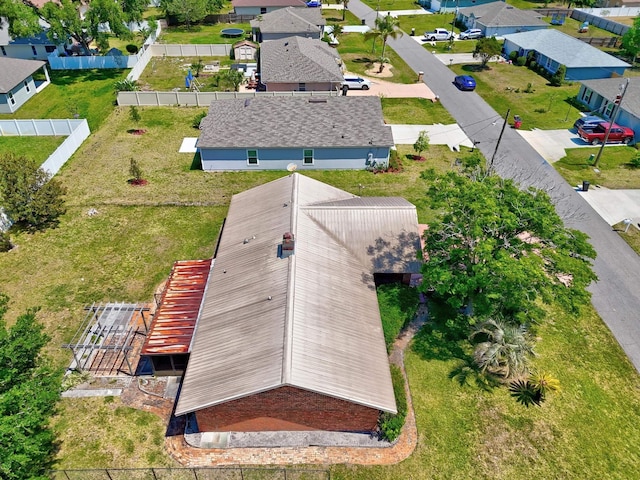 birds eye view of property with a residential view