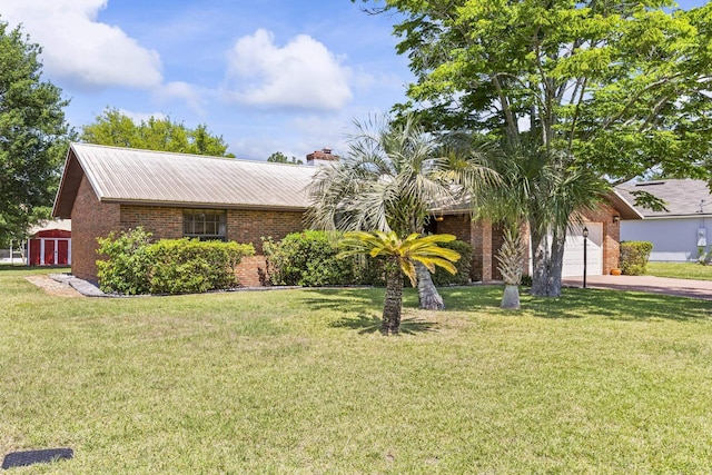 ranch-style house with brick siding, a front lawn, and concrete driveway