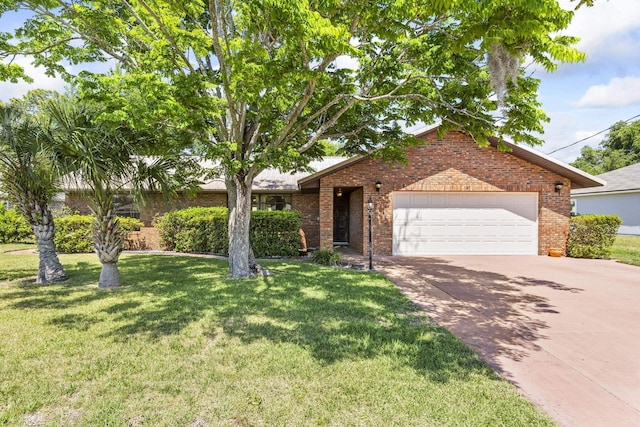 view of front of home with driveway, brick siding, a front yard, and a garage