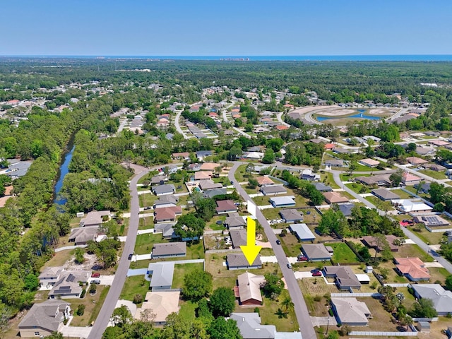 bird's eye view featuring a residential view and a view of trees