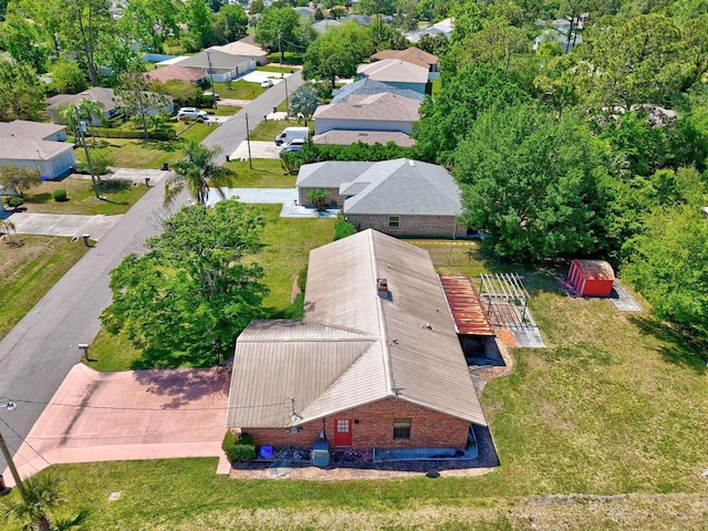 birds eye view of property with a residential view
