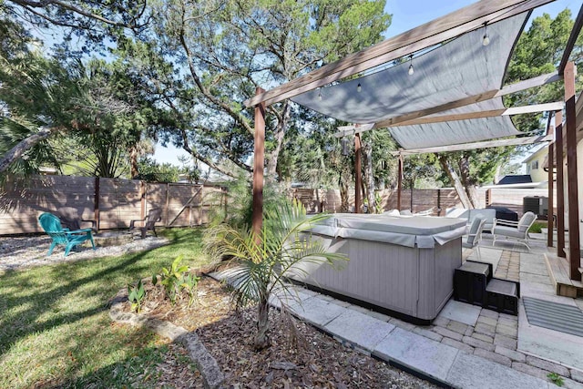 110 Arredondo Ave, Saint Augustine, FL 32080 - view of yard featuring a hot tub, a fenced backyard, a pergola, and a patio area