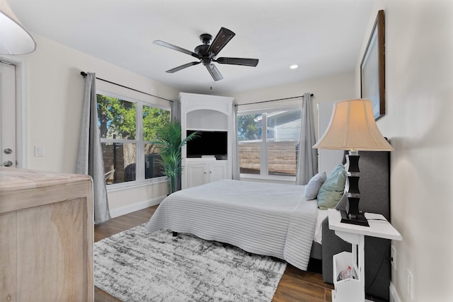 110 Arredondo Ave, Saint Augustine, FL 32080 - bedroom with dark wood-type flooring, ceiling fan, baseboards, and multiple windows