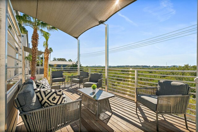 wooden deck featuring outdoor lounge area