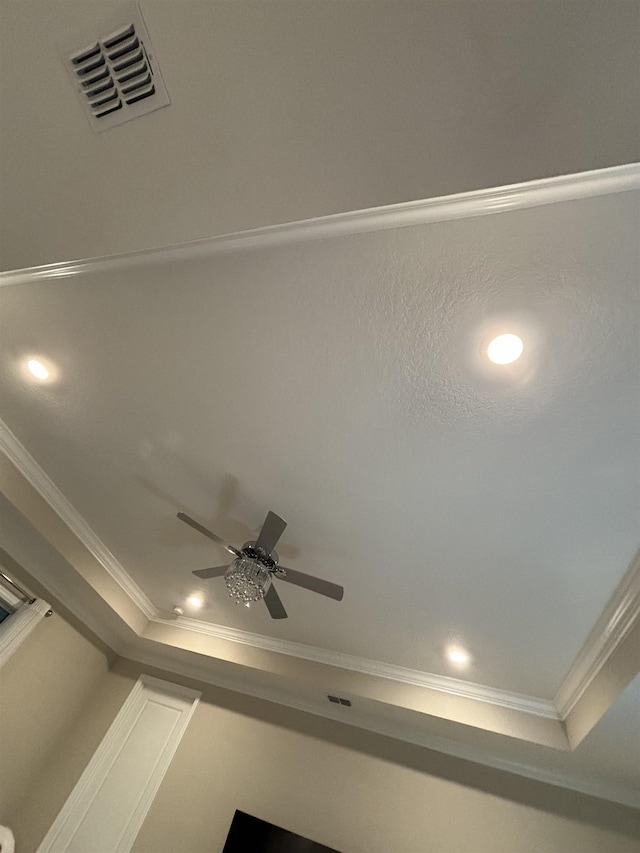 room details featuring ceiling fan and ornamental molding