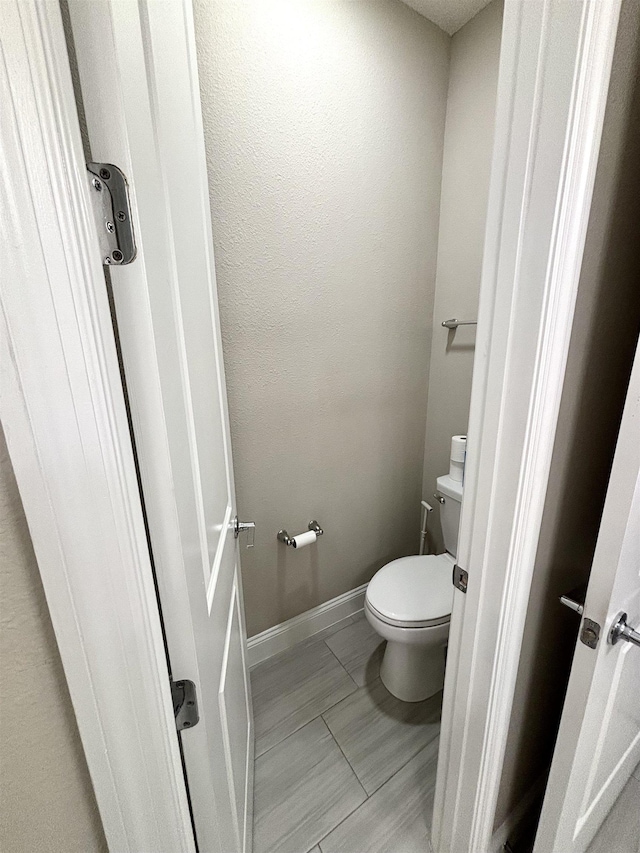 bathroom featuring toilet