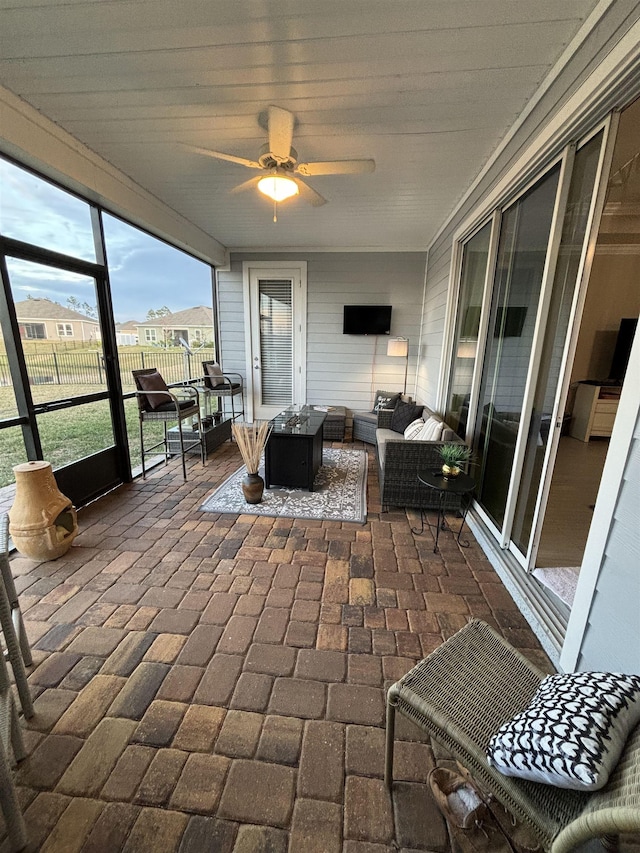 sunroom / solarium with ceiling fan