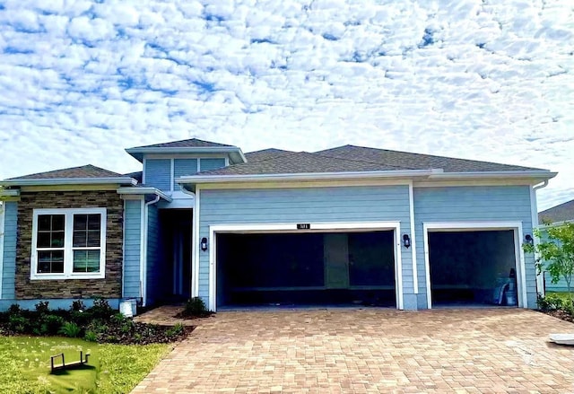 view of front of property with a garage