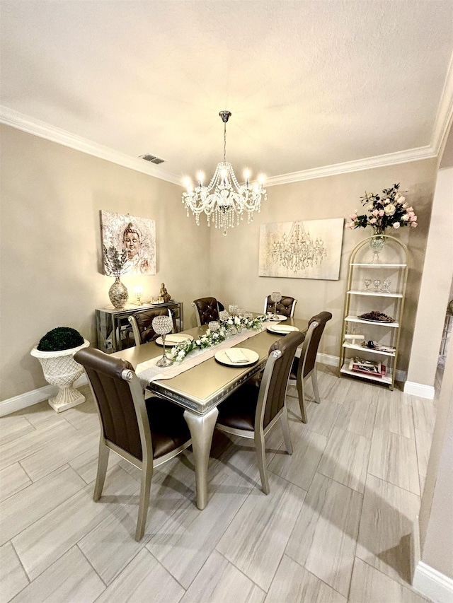 dining area with hardwood / wood-style flooring, ornamental molding, a textured ceiling, and an inviting chandelier