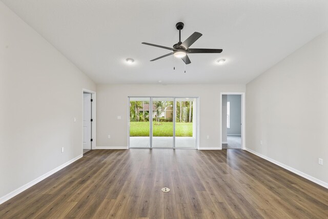 unfurnished room featuring ceiling fan and dark wood-type flooring