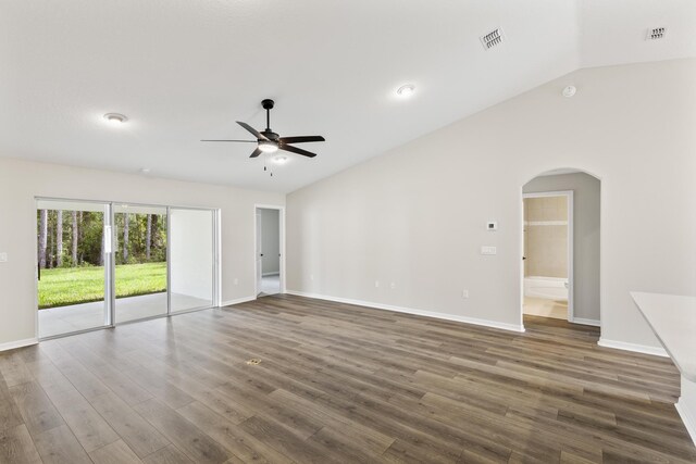 unfurnished room with ceiling fan, lofted ceiling, and dark wood-type flooring