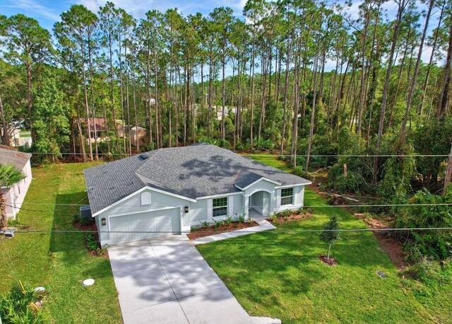 exterior space featuring a front yard and a garage