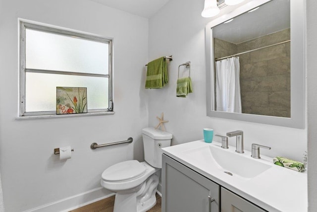 167 Deltona Blvd, Saint Augustine, FL 32086 - full bathroom with toilet, vanity, baseboards, and curtained shower