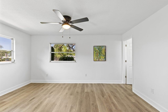 167 Deltona Blvd, Saint Augustine, FL 32086 - spare room featuring healthy amount of natural light, light wood-style floors, baseboards, and a textured ceiling