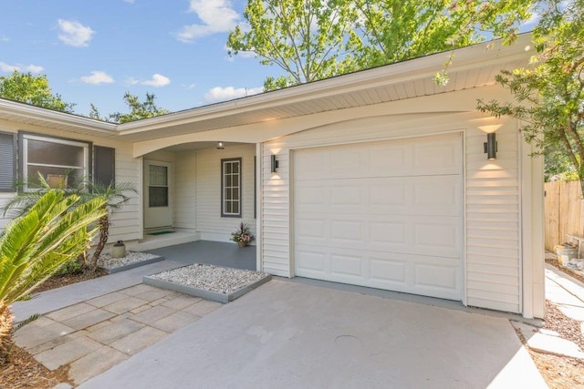167 Deltona Blvd, Saint Augustine, FL 32086 - view of front of house featuring driveway, an attached garage, and fence