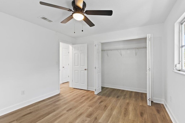 167 Deltona Blvd, Saint Augustine, FL 32086 - unfurnished bedroom featuring wood finished floors, baseboards, a closet, and a ceiling fan