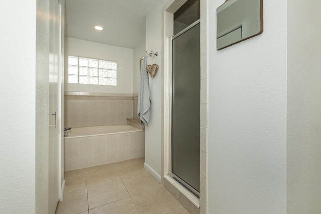 bathroom with plus walk in shower and tile patterned floors