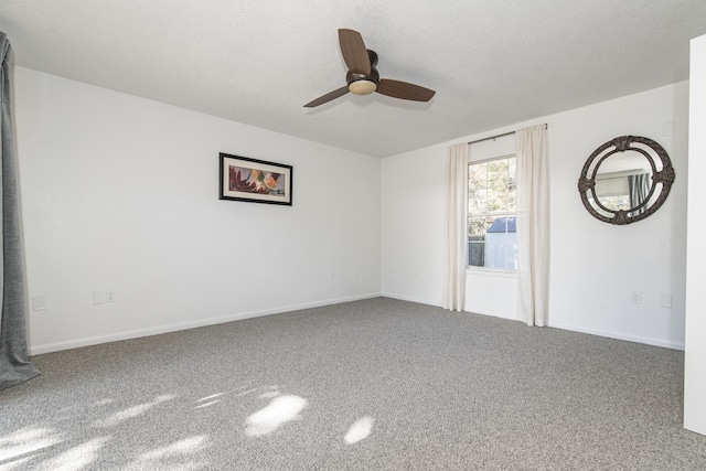 spare room with ceiling fan, carpet floors, and a textured ceiling