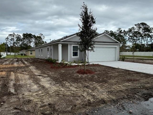 single story home featuring a garage