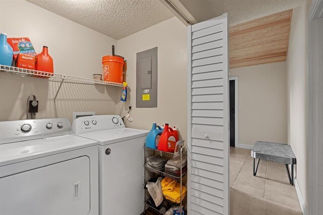 100 Saturn Rd, Saint Augustine, FL 32086 - laundry room featuring electric panel, independent washer and dryer, a textured ceiling, and light tile patterned floors