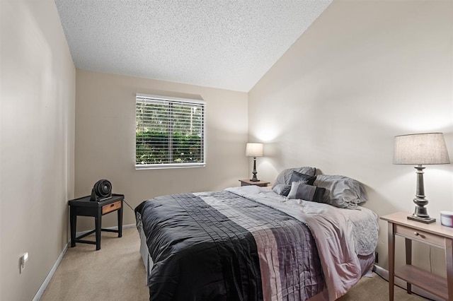 100 Saturn Rd, Saint Augustine, FL 32086 - bedroom with light colored carpet, vaulted ceiling, and a textured ceiling
