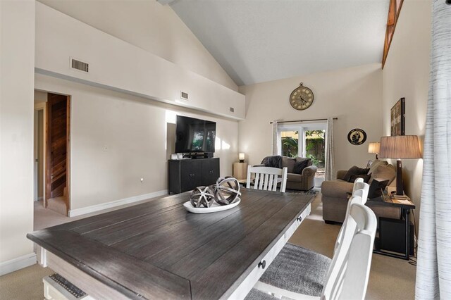 100 Saturn Rd, Saint Augustine, FL 32086 - dining area with high vaulted ceiling and light carpet
