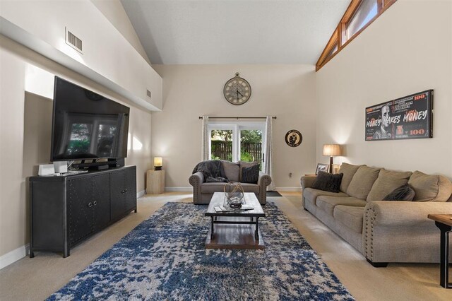 100 Saturn Rd, Saint Augustine, FL 32086 - living room with light colored carpet and vaulted ceiling