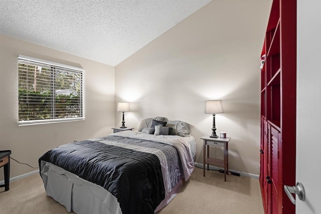 100 Saturn Rd, Saint Augustine, FL 32086 - bedroom with carpet flooring, vaulted ceiling, and a textured ceiling