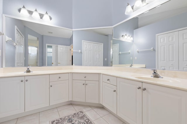 bathroom with tile patterned flooring and vanity