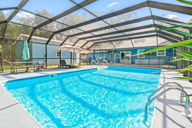 view of pool featuring a lanai and a patio