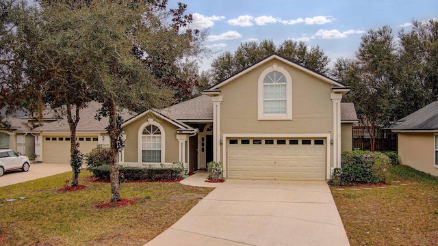 view of front property with a garage and a front lawn