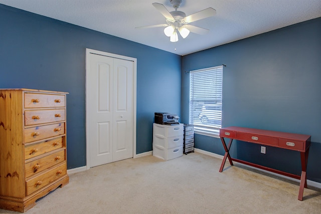 interior space with ceiling fan and light carpet