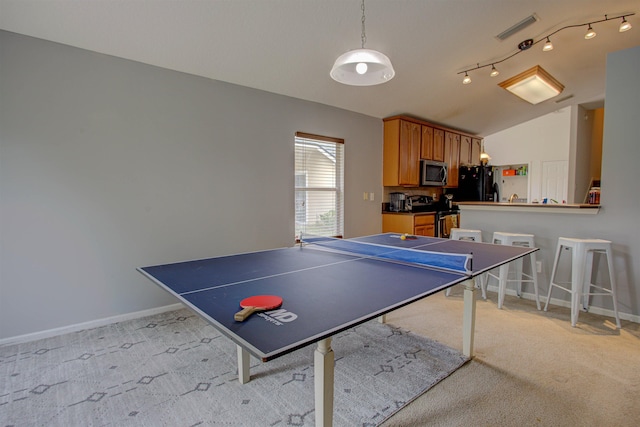 game room featuring light colored carpet and vaulted ceiling