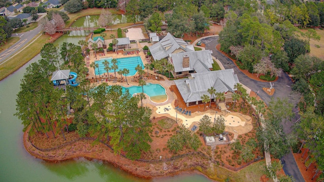 birds eye view of property with a water view