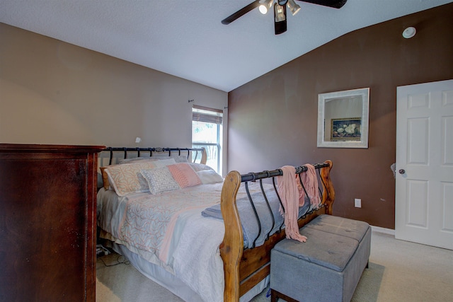 carpeted bedroom with ceiling fan and lofted ceiling