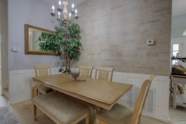 dining space with a notable chandelier