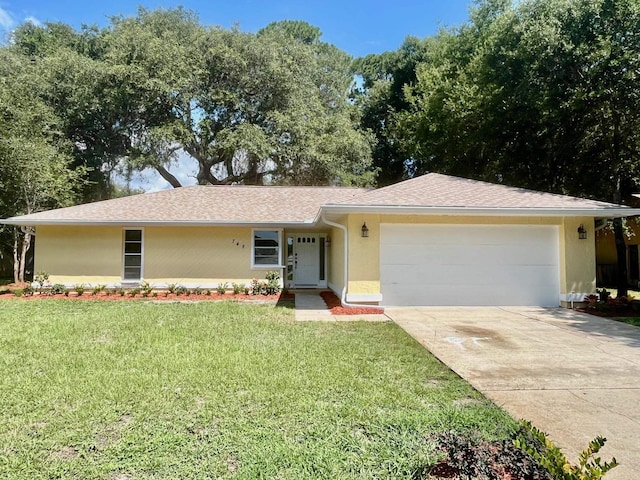 single story home with a front lawn and a garage