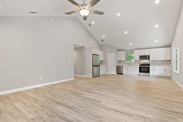 2891 N 8th St, Saint Augustine, FL 32084 - unfurnished living room featuring high vaulted ceiling, a ceiling fan, light wood-style floors, and recessed lighting