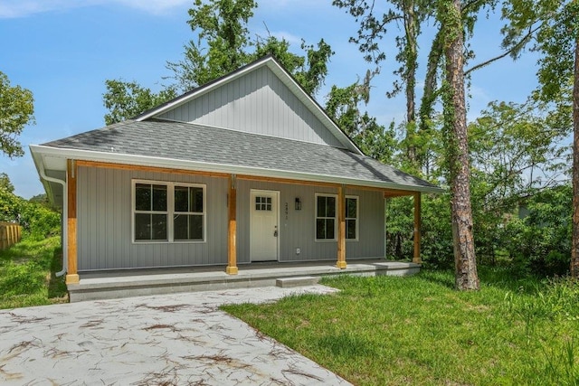 2891 N 8th St, Saint Augustine, FL 32084 - view of front of property with roof with shingles and covered porch