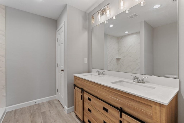 2891 N 8th St, Saint Augustine, FL 32084 - full bathroom featuring wood finished floors, double vanity, and recessed lighting