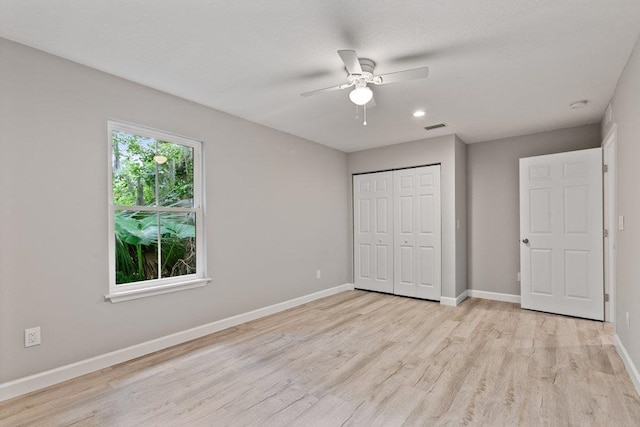 2891 N 8th St, Saint Augustine, FL 32084 - unfurnished bedroom featuring light wood-style flooring, a closet, a ceiling fan, and recessed lighting