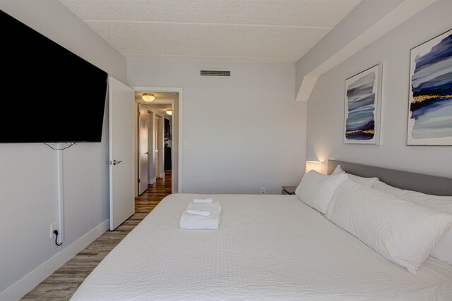 390 A1A Beach Blvd Unit 43, Saint Augustine Beach, FL 32080 - bedroom with wood finished floors and baseboards