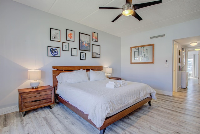 390 A1A Beach Blvd Unit 43, Saint Augustine Beach, FL 32080 - bedroom featuring light wood-type flooring, baseboards, and ceiling fan
