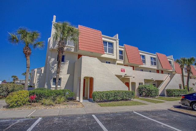 390 A1A Beach Blvd Unit 43, Saint Augustine Beach, FL 32080 - view of building exterior with uncovered parking