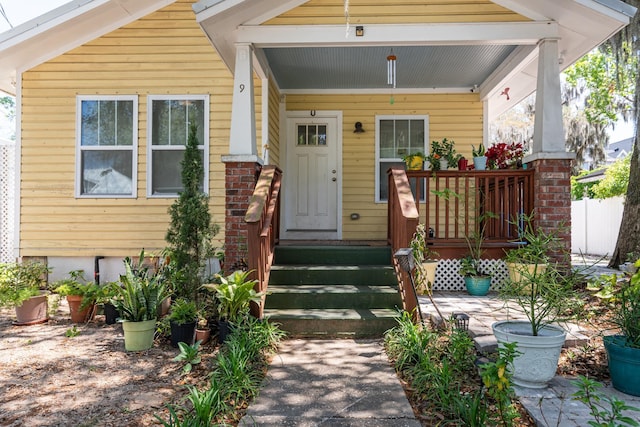 property entrance featuring covered porch