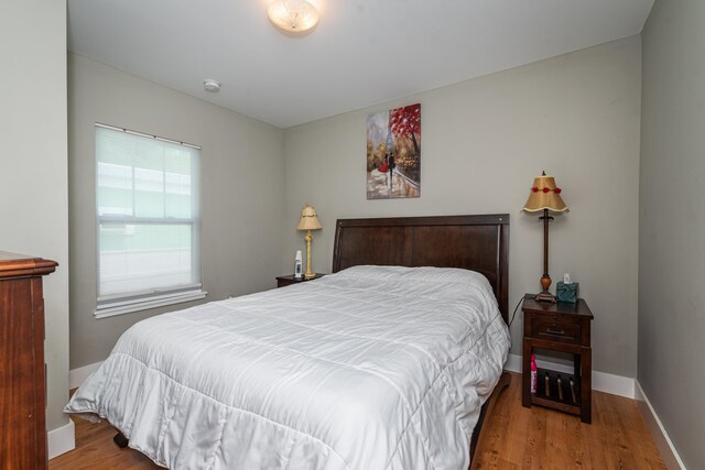 bedroom with light hardwood / wood-style flooring