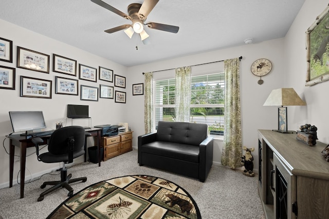 office space with ceiling fan and a textured ceiling