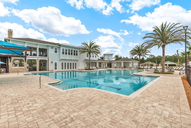 view of swimming pool featuring a patio area