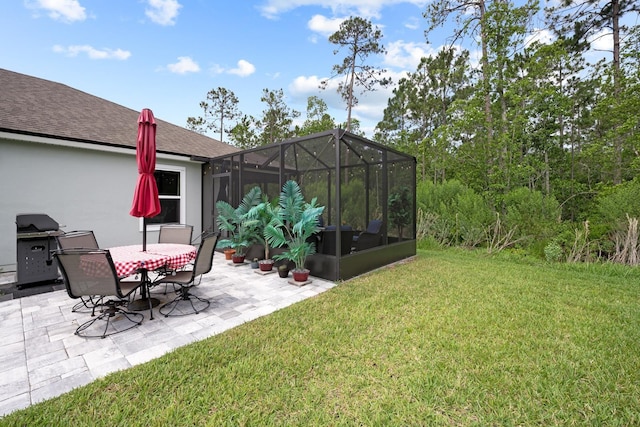 view of yard featuring a patio and a lanai